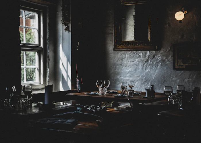 Wine glasses set out by the window